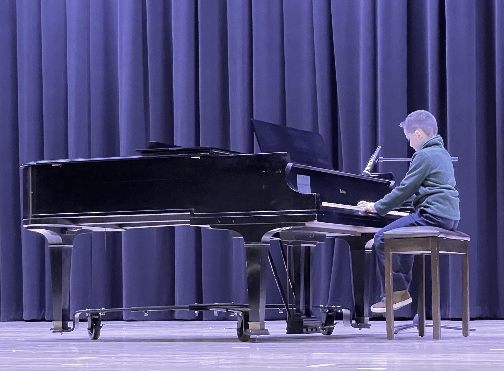 Second-grader Anthony Olivera played the piano 
