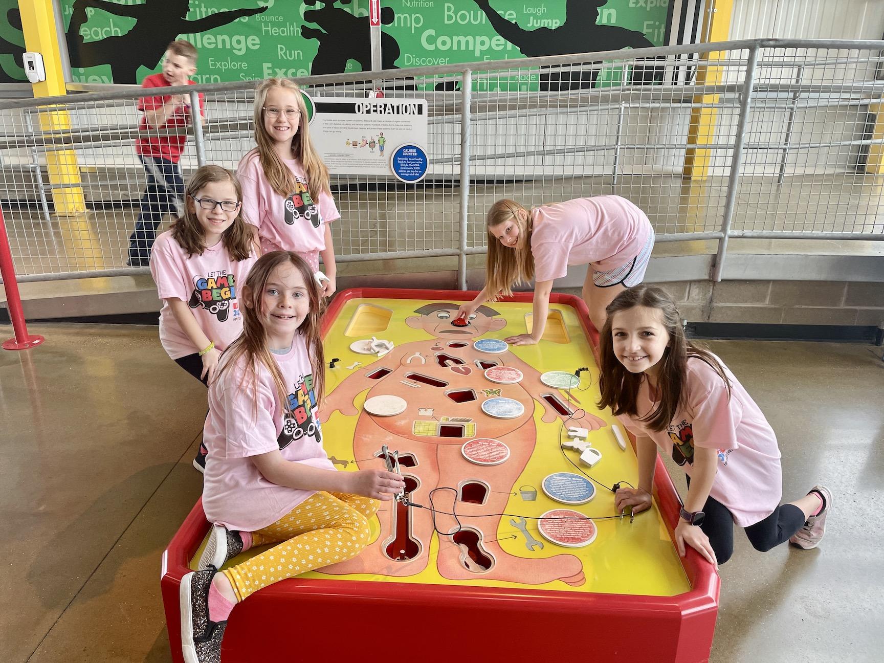 Harrison Park students Lunabelle Coates, Sierra Mason, Helena Sever, Addison Comer and Lucy Massarelli enjoy a giant game of Operation!