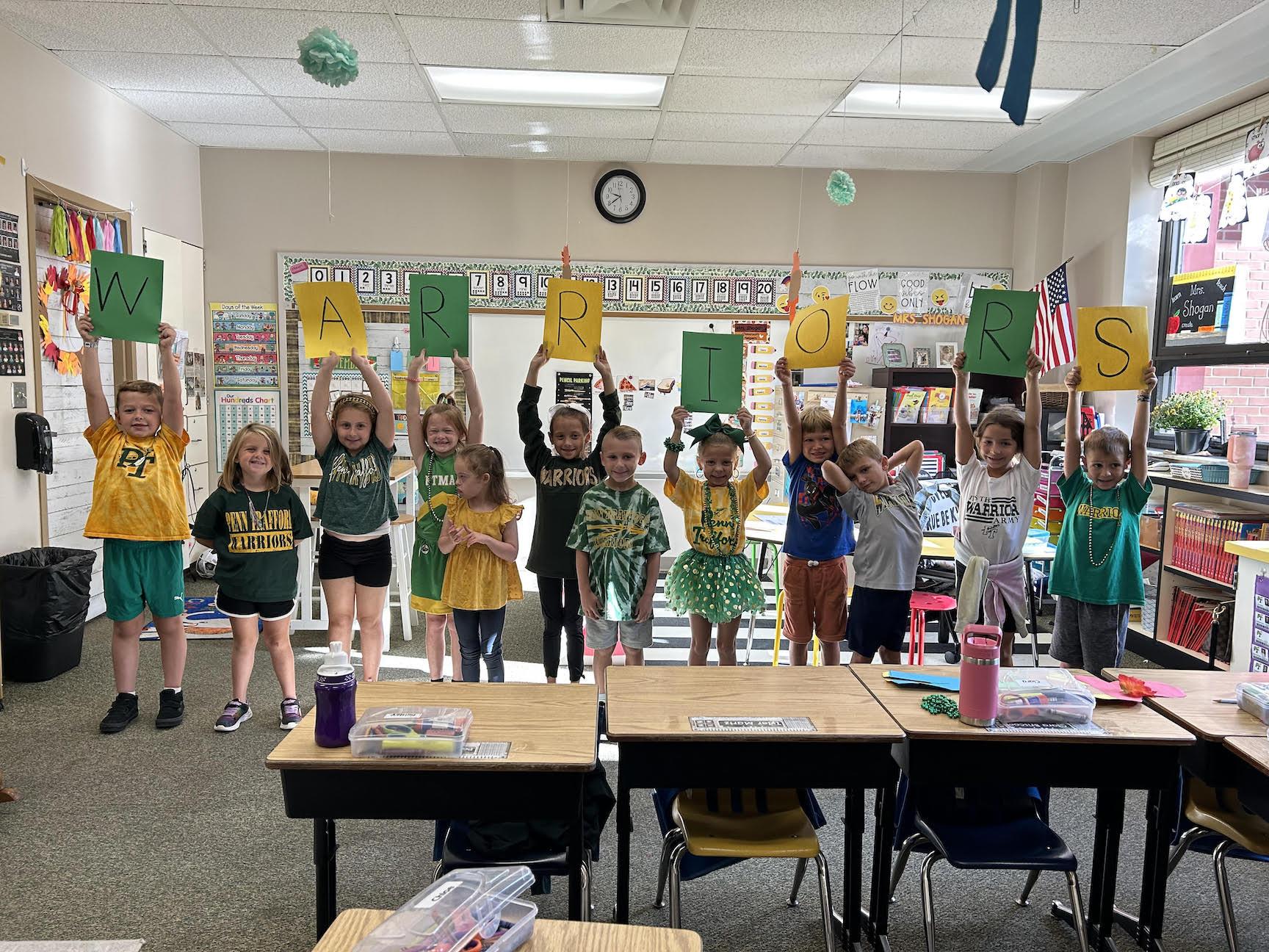 Mrs. Shogan’s 1st-graders at Level Green Elementary show their Warrior Pride on Green & Gold Friday