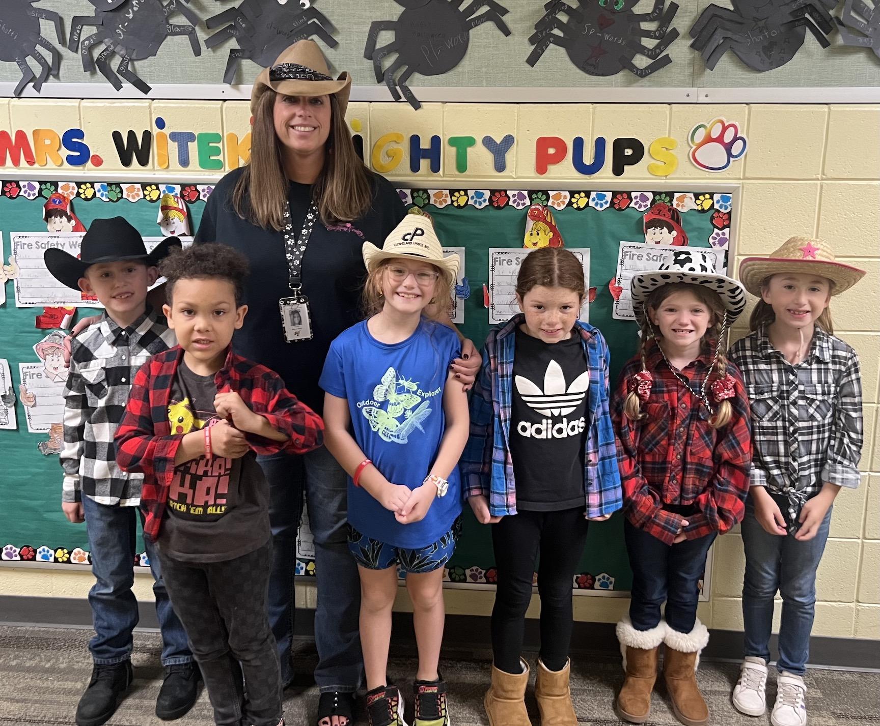 Mrs. Witek and some of her second-grade students dress in country theme to declare they will ‘kick drugs into the mud’