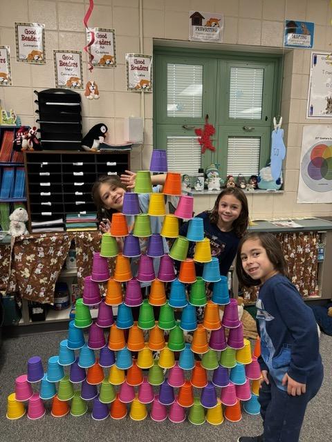 Trafford Elementary 1st-graders Francesca Miele, Rylan Del Signore and Ian Maldonado created a tower of 100 cups during one of the 100th Day STEM projects